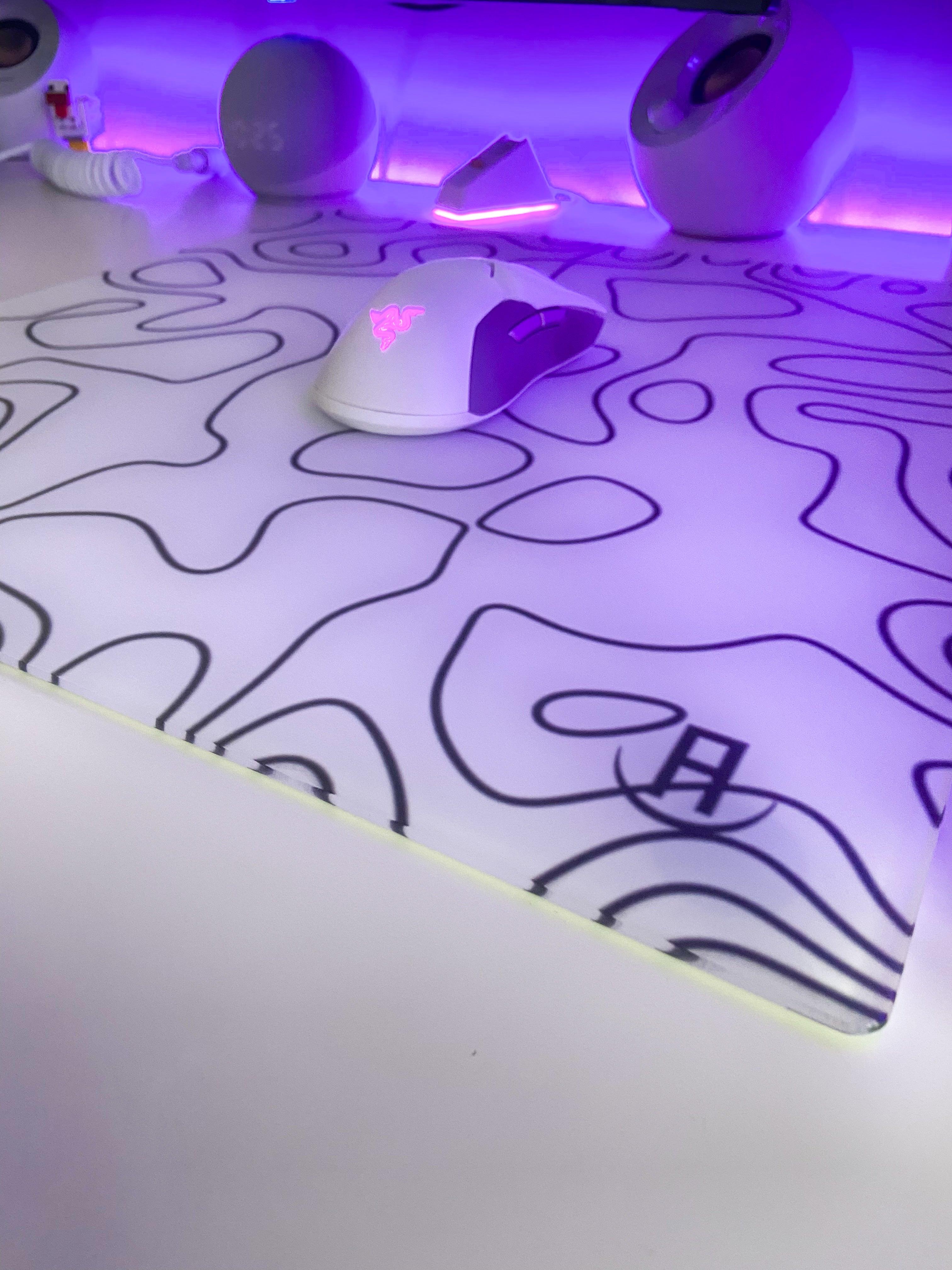 white topography glass mousepad on desk in gaming setup