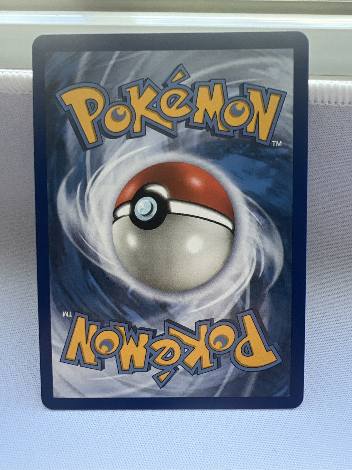 Pokémon trading card with a Poké Ball design on a white background