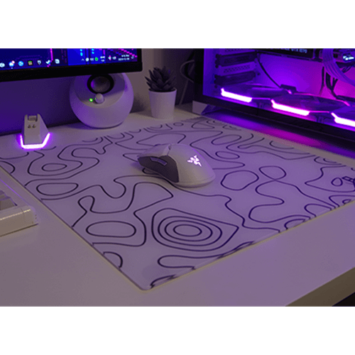 white topography glass mousepad in gaming setup on desk with gaming mouse